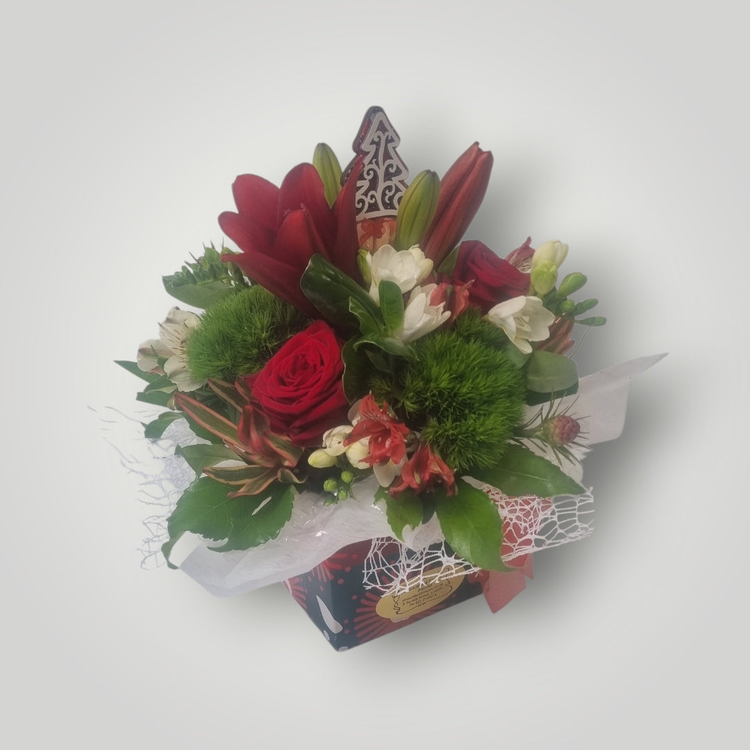 Christmas texture and tidings to you. Flowers arranged in a box.