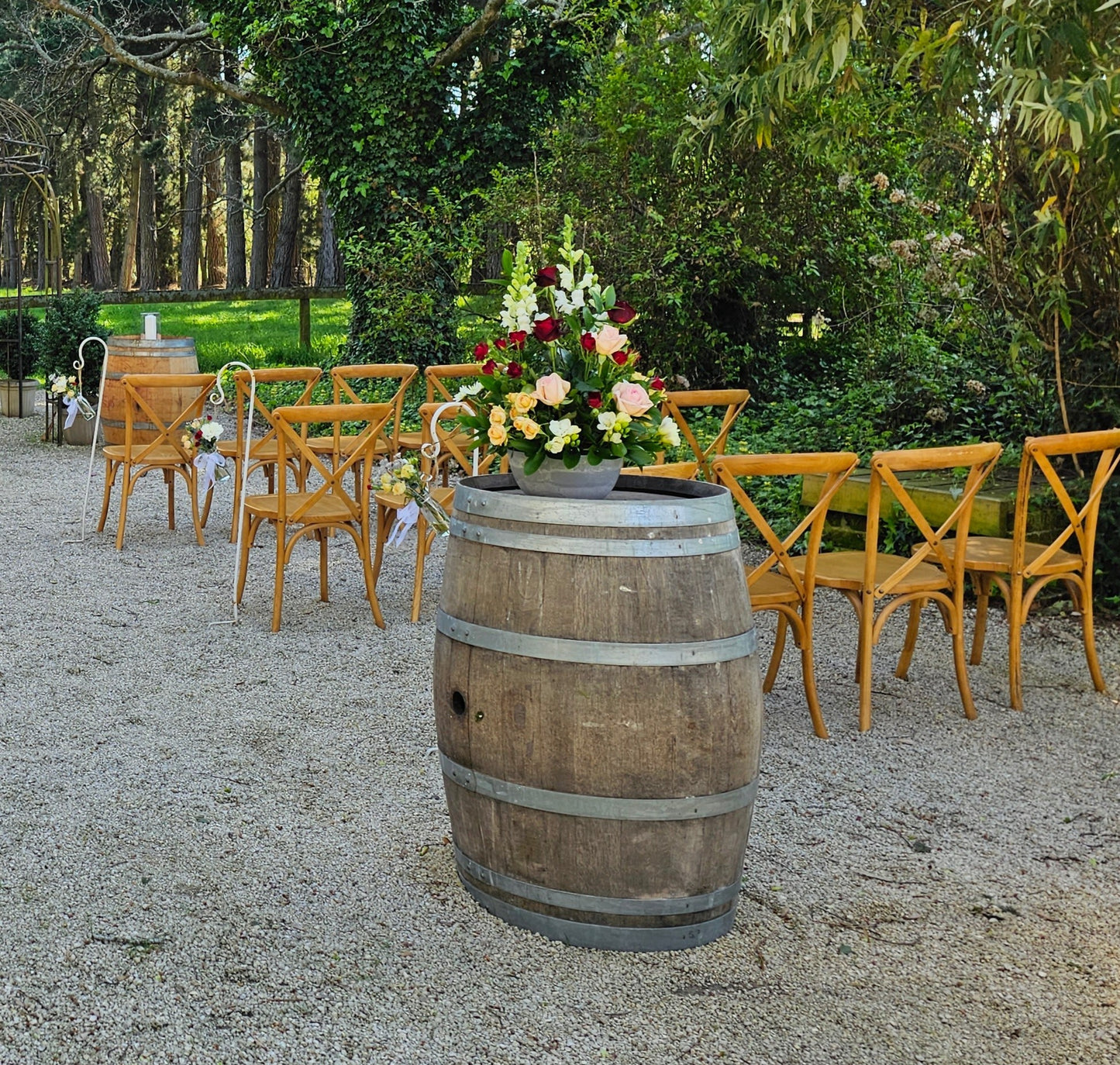 arrangement on a barrel to decorate a function, includes roses, carnations, antirrinums,
