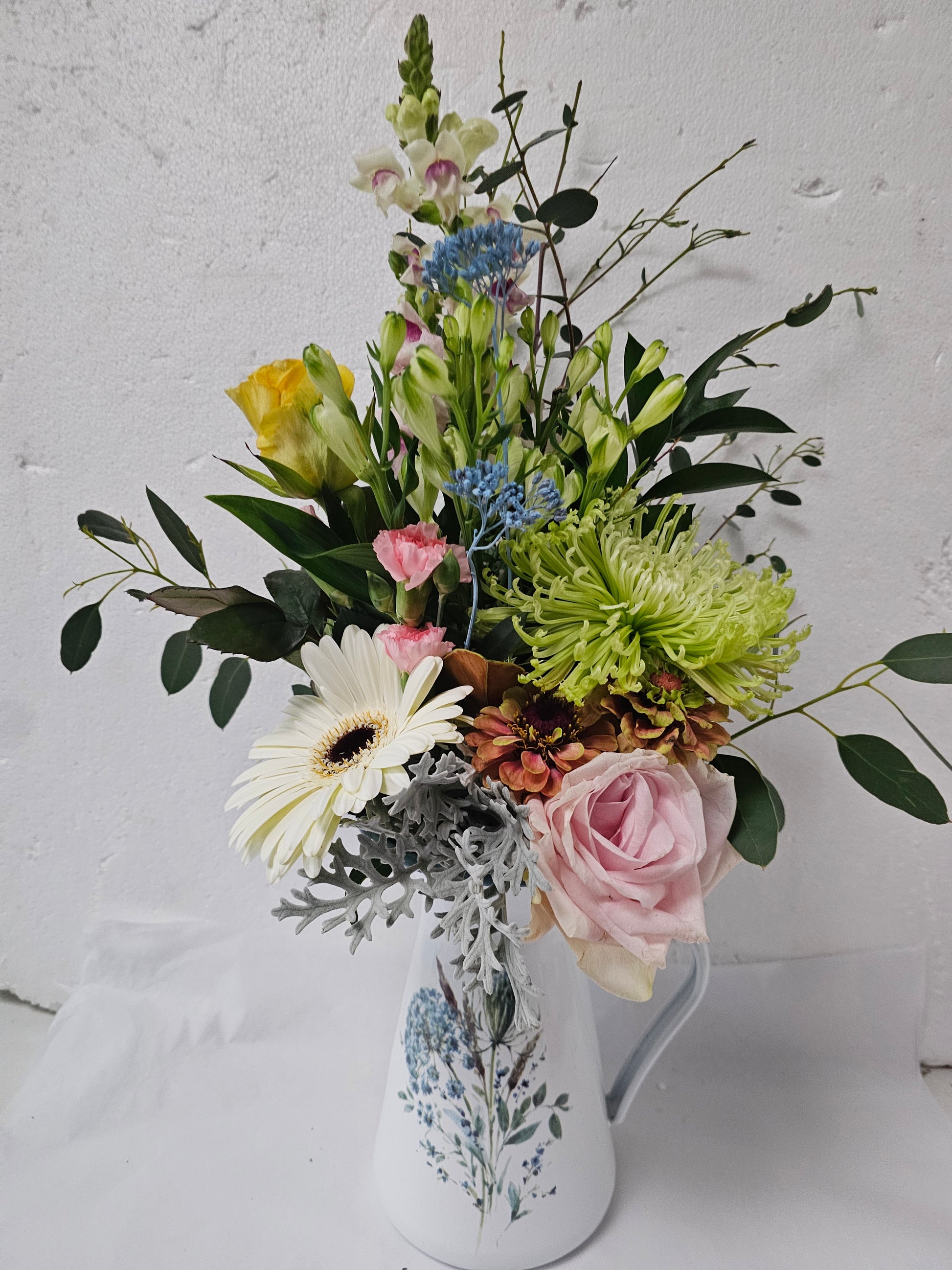 A blue floral jug flower arrangement Jug sold out Urn still available - Broadfield Flowers Florist Lincoln