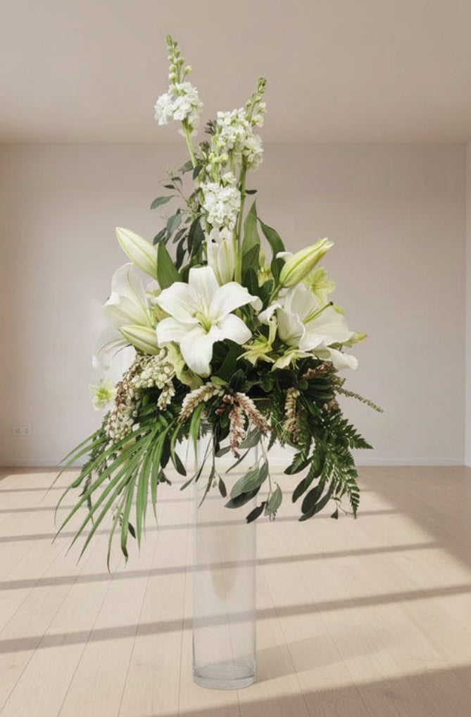 Flower Arrangement on top of a tall cylinder - Broadfield Flowers Florist Lincoln