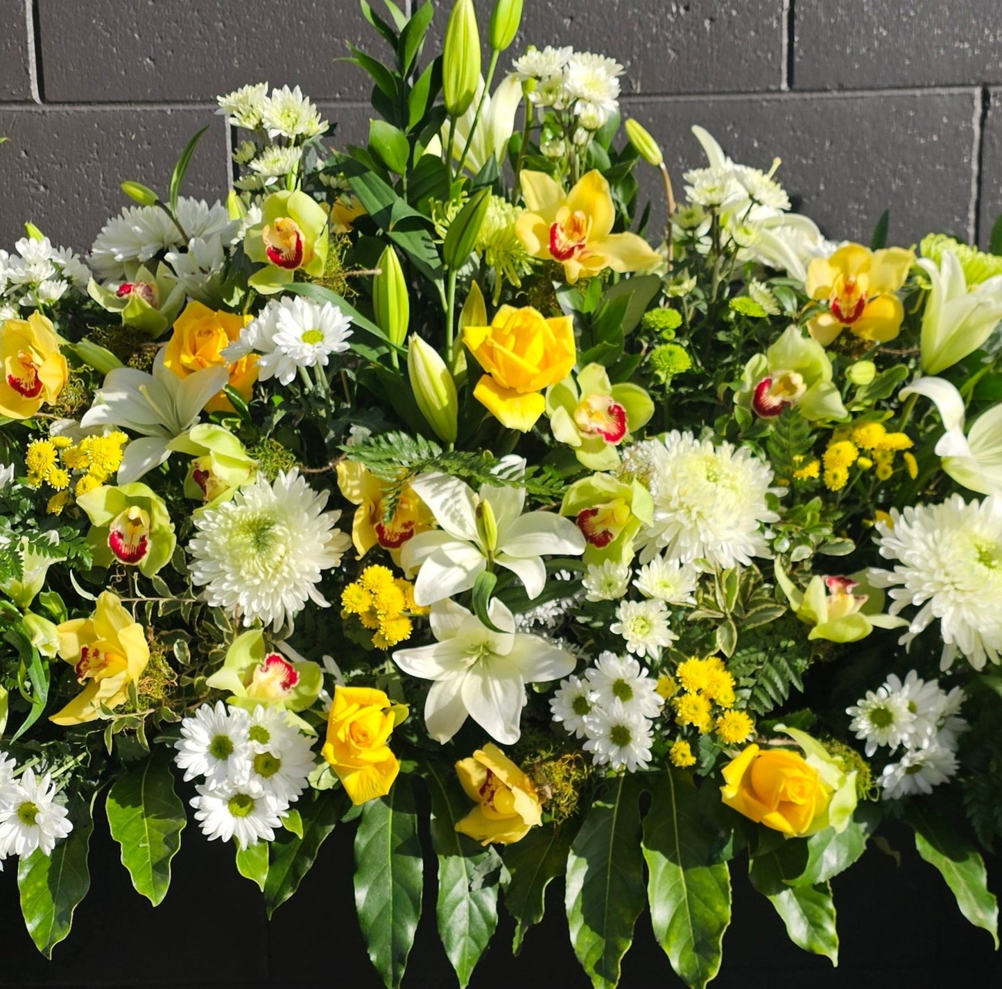 close up of flowers in extra special casket spray