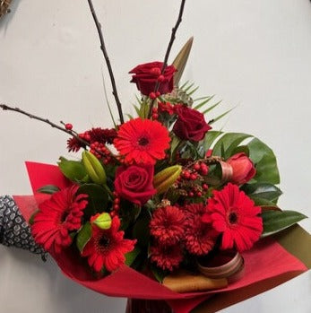 Romantic Soul flower bouquet - monstera leaf, red geberas, roses, lillies, chrysthemum, flax