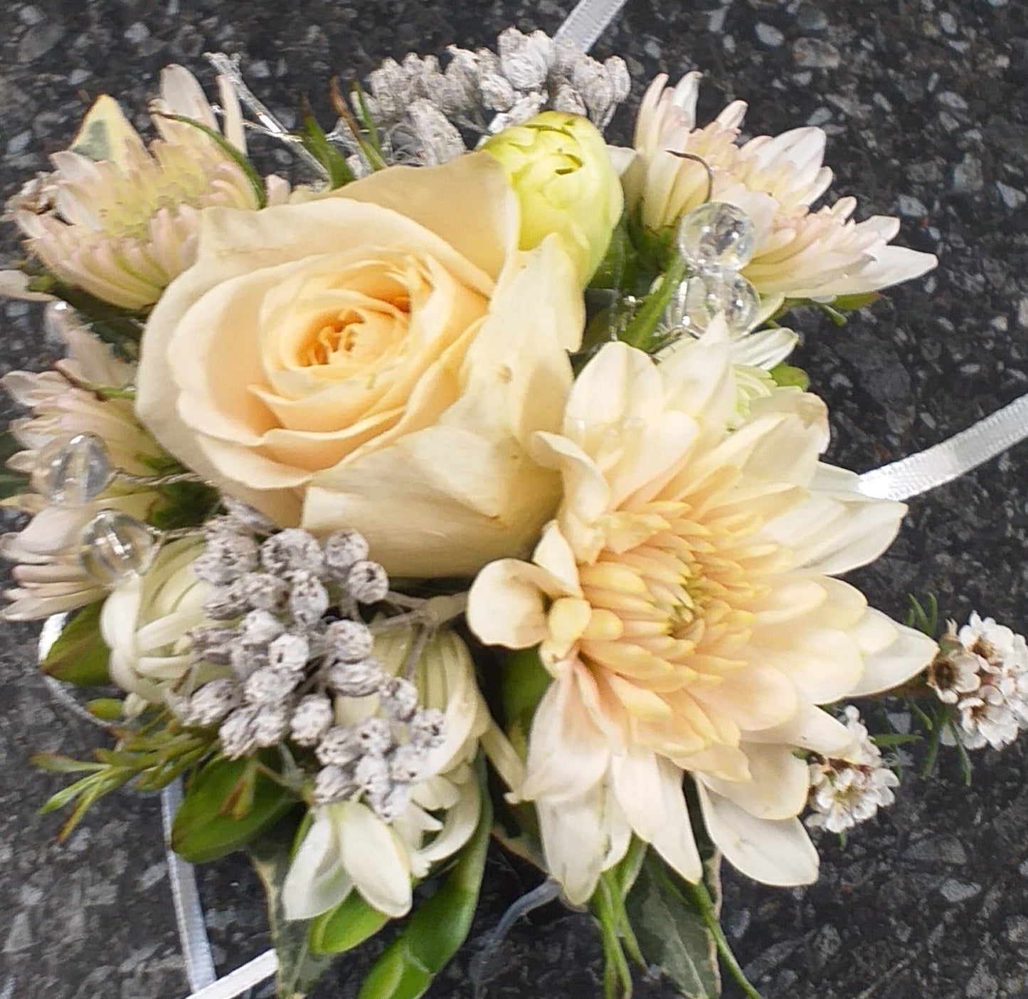 wrist corsage on pearl band cream and white flowers