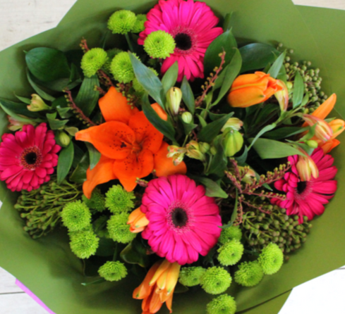Neon Glow flower bouquet, hot pink gerberas, orange lily, green chrysanthemum, alstroemeria, berries, wrapped in green - Broadfield Flowers Florist Lincoln