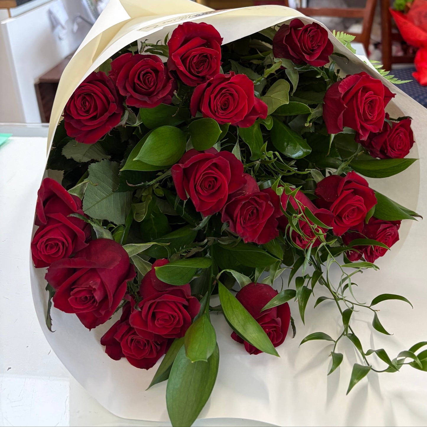 bouquet of 17 red roses in white wrap