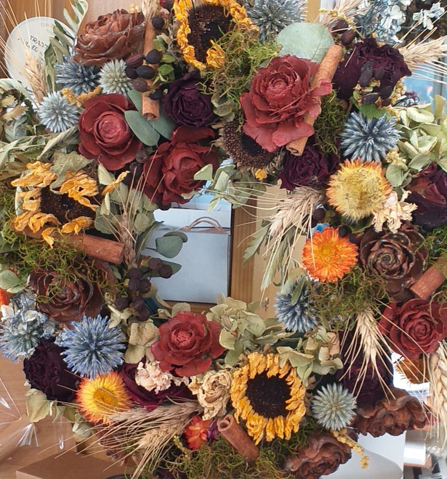 circle wreath dried flowers sunflowers, roses, wheat, thistles, pine cones