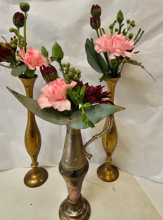 small side table decorations in brass vases