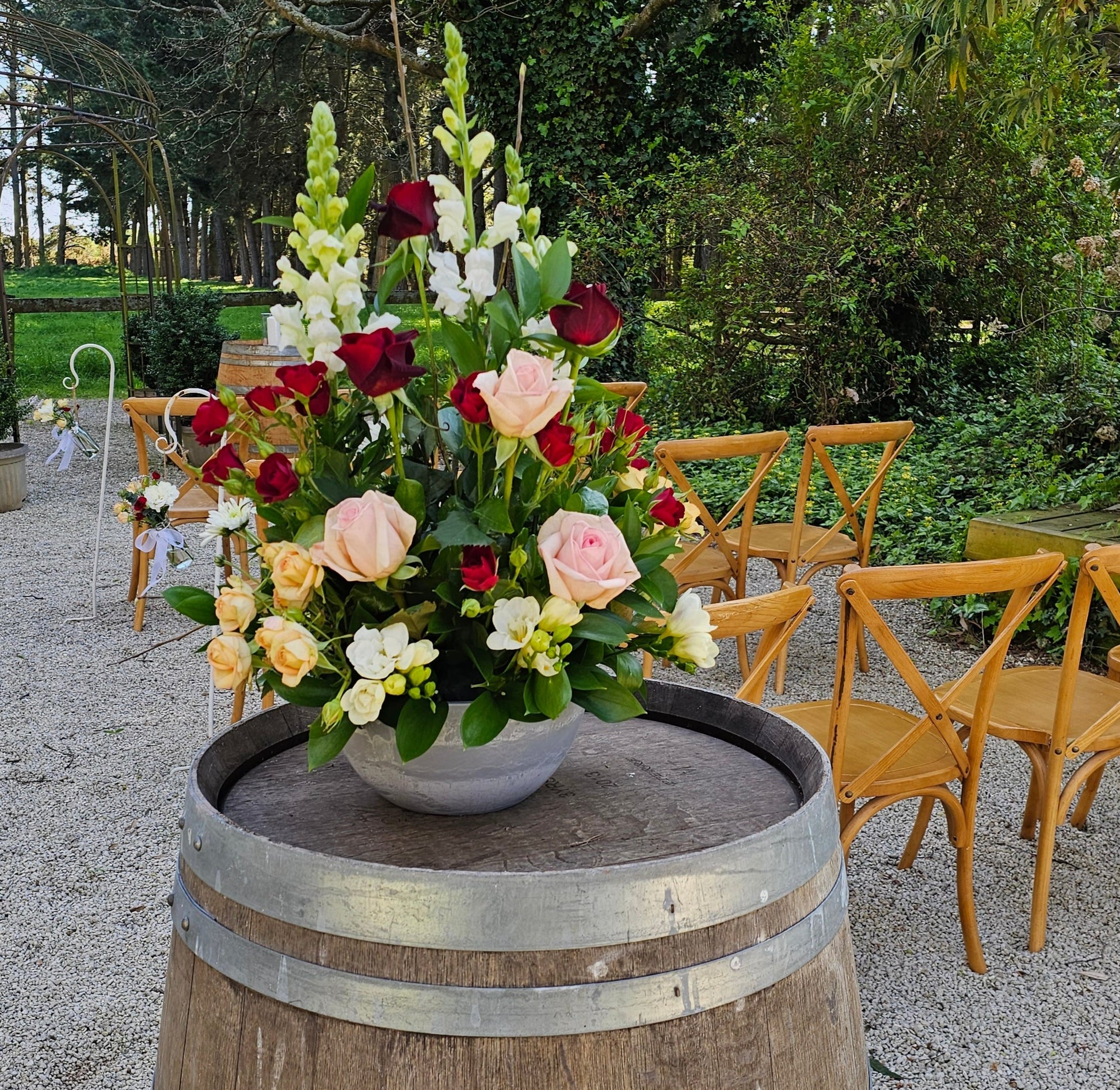 Arrangement on a barrel for a wedding decoration in the garden