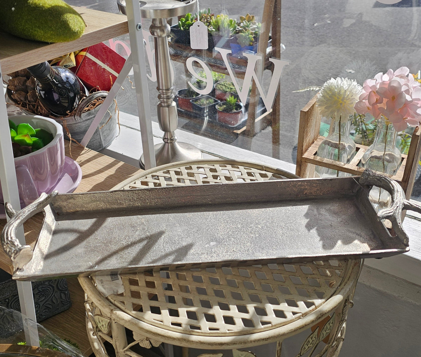 Decorative silver tray with antler design handles