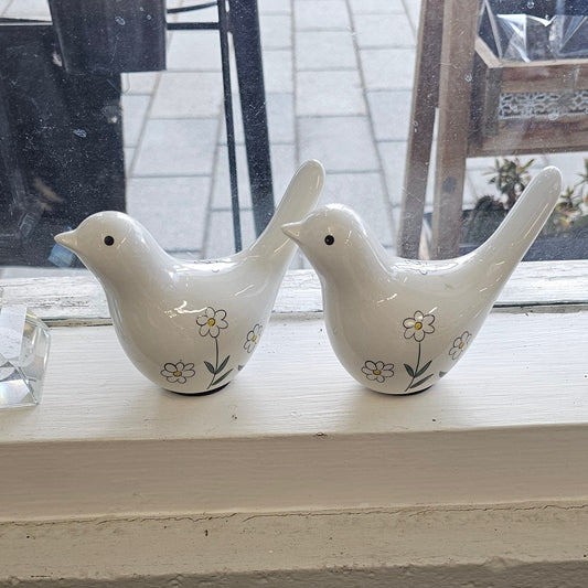 White ceramic birds with blue decoration
