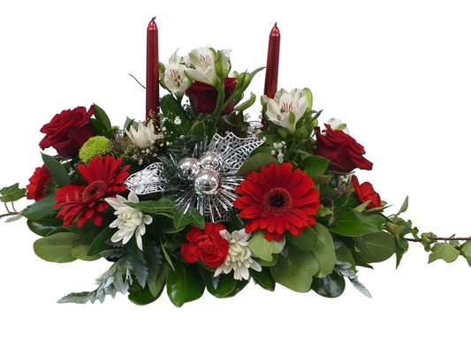 A Flower Arrangement Christmas Table Decoration with Candles