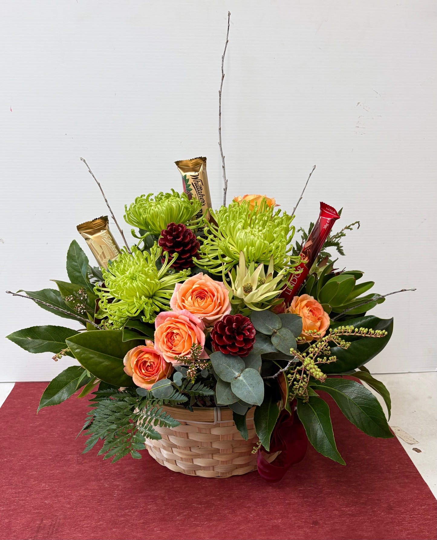Basket of bold flowers with Chocolate
