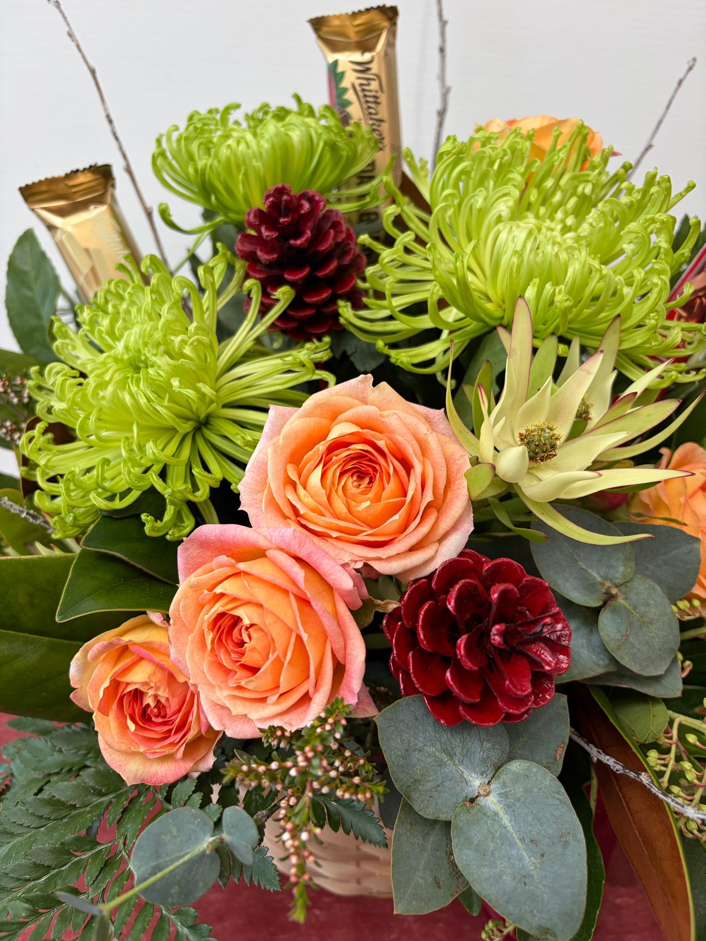 Basket of bold flowers with Chocolate