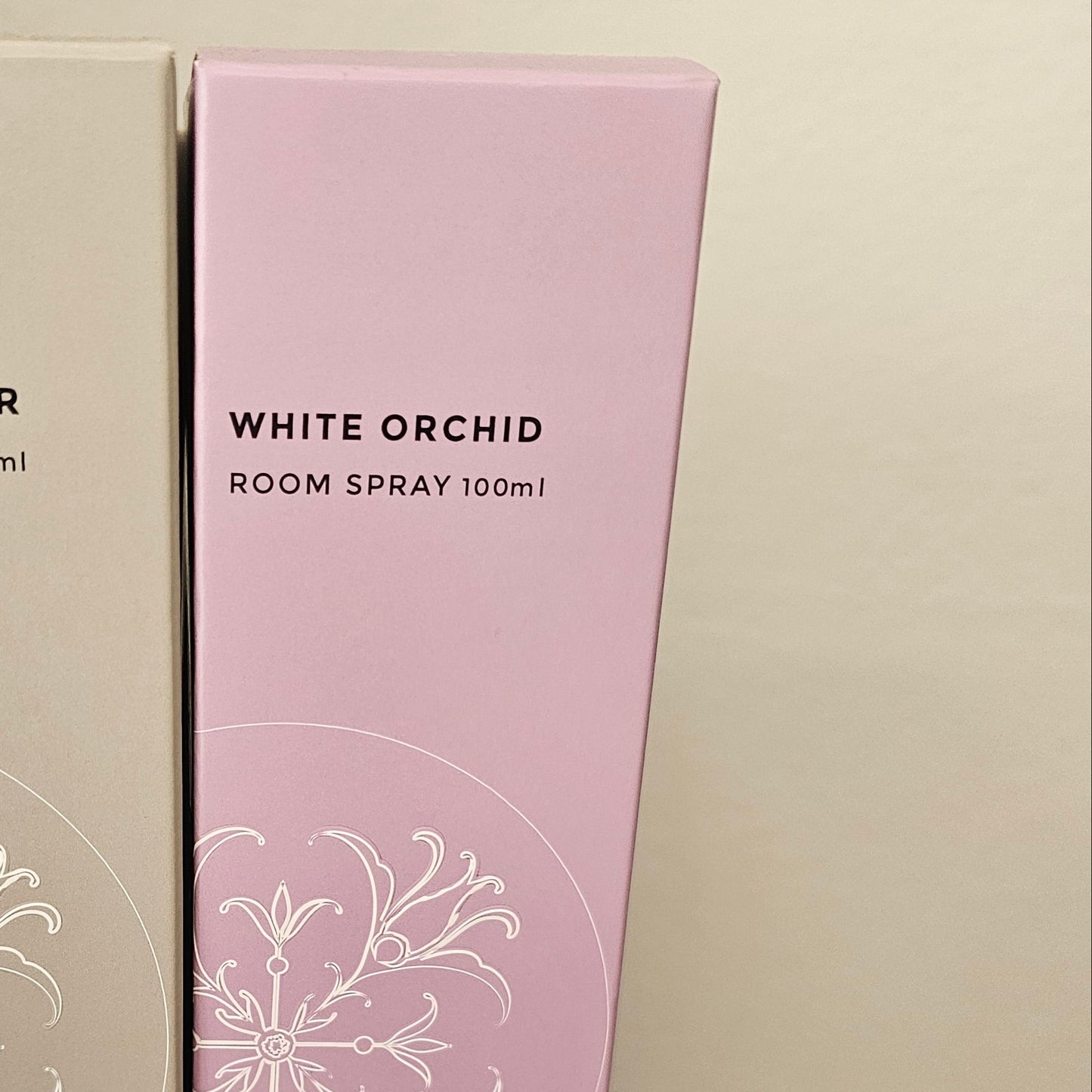 A pink box labeled 'White Orchid' 