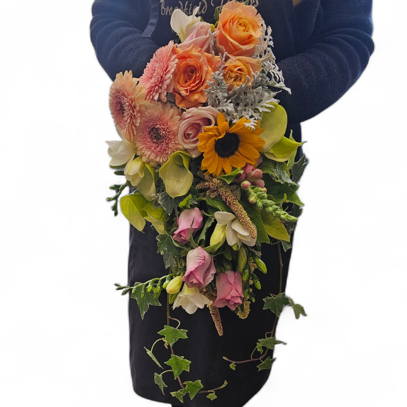 Bouquet roses, callas, sunflower, gerbera, freesias, amaranthus(hanging), ivy, cineraria( silver foliage)