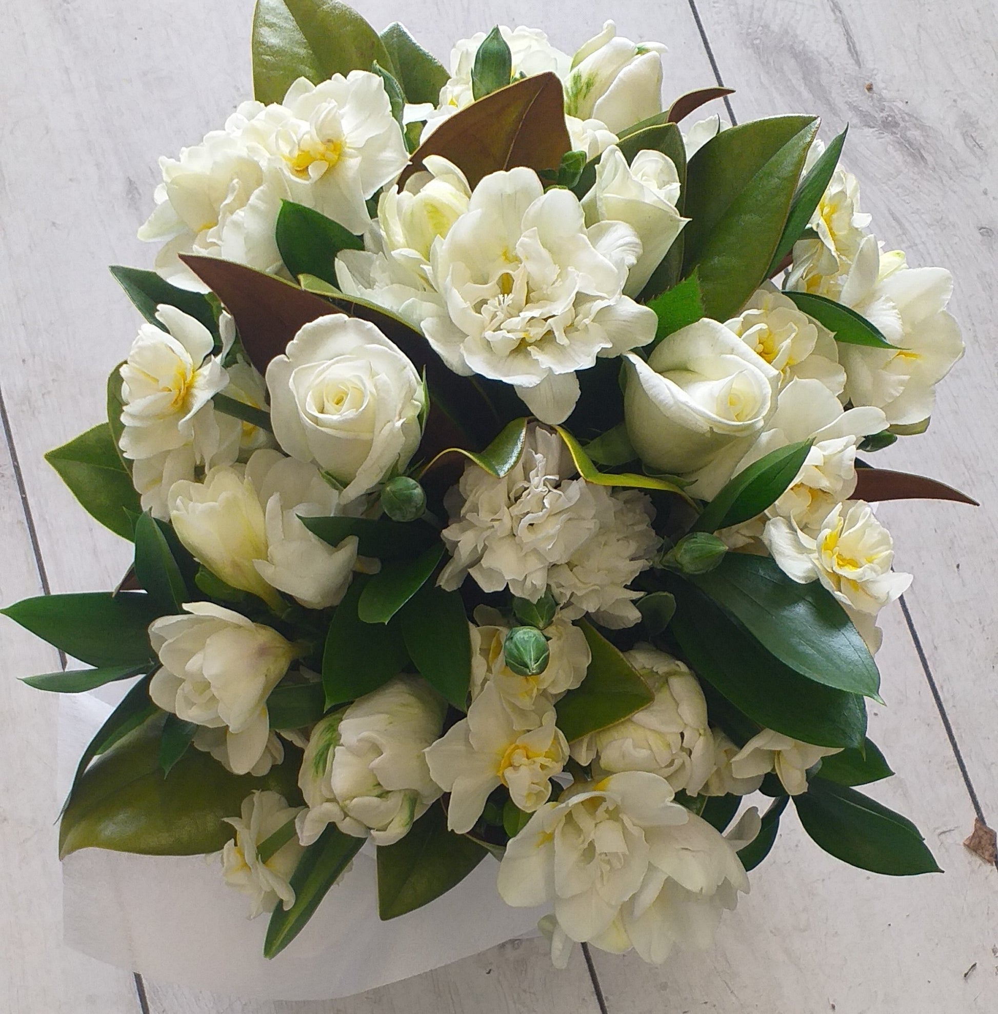 white roses, freesias, jonquils and chrysanthemums