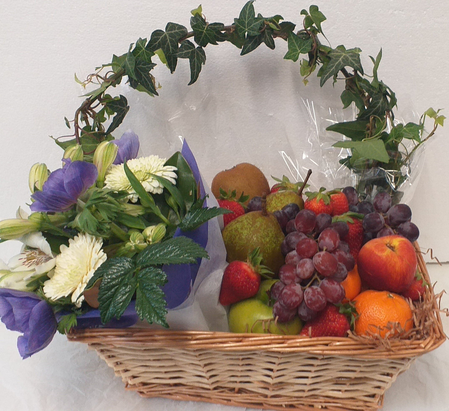 Tray of a flower posy and a selection of seasonal fruit, depending on what's avilable