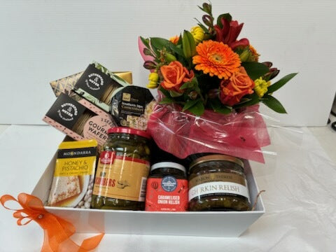 Gift basket with flowers and gourmet items
