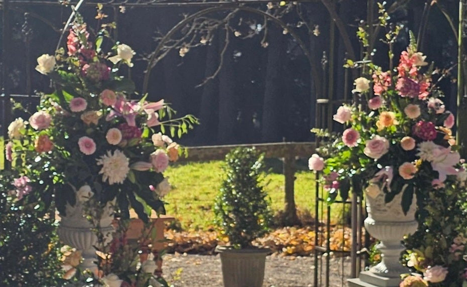 Flower arrangements to decorate archway pink and white