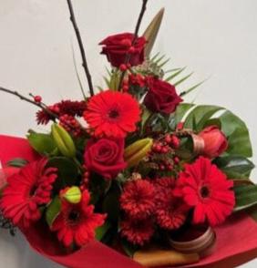 beautiful red roses, red gerbera, berries and lilies