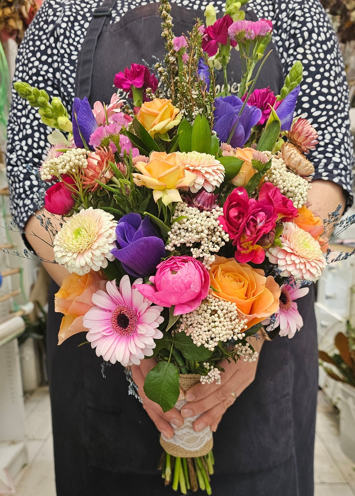  a large, vibrant, multicolored bridal bouquet 