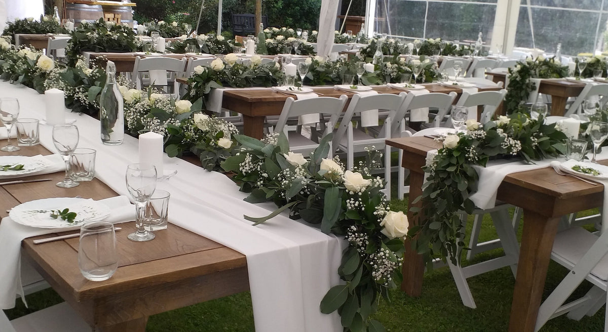 wedding table swag of white roses, gyp, and gum  branches