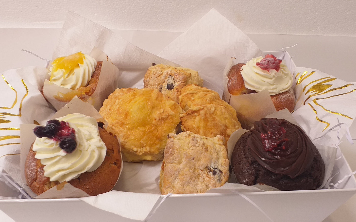 A delicious tray of gourmet muffins and scones, a super treat for a special person or occasion 