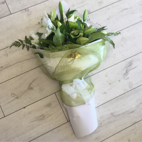Naturally New Zealand flower bouquet, white lily, green chrysthemum, flax flowers, fern. Wrapped in white paper and green netting- Broadfield Flowers Florist Lincoln