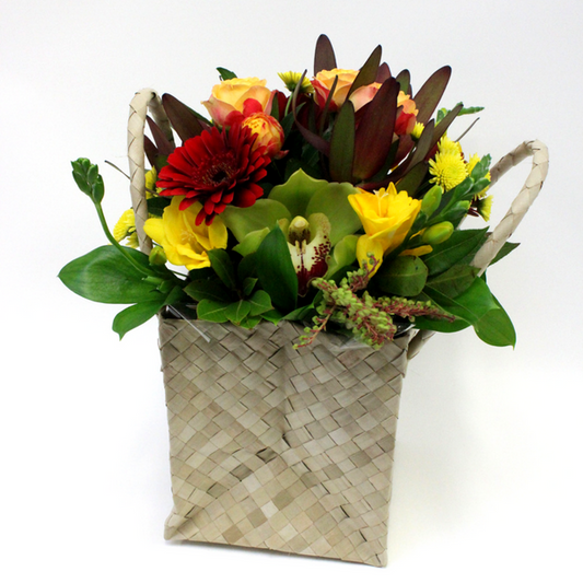 Textured Posy in a Flax Handbag with red gerberas, leucs, yellow freesias, green orchids, roses - Broadfield Flowers Florist Lincoln