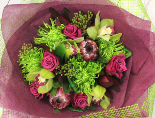 Funkalicious flower bouquet, green chrysthemum, pink proteas, roses, green orchids, wrapped in green and pink