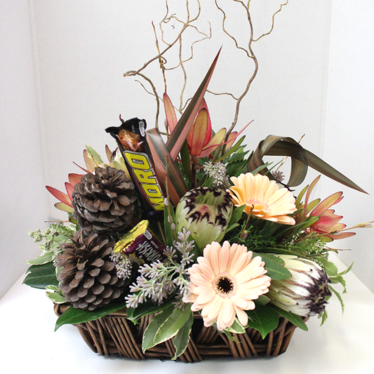 Flower Basket - proteas, gerberas, leucodedrons, flax greenery pine cones and chocolates