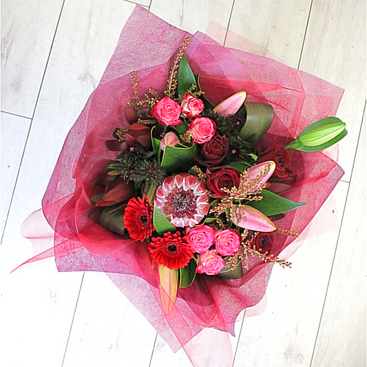 Magenta Mood flower bouquet, protea, lily, roses, spray roses, gerberas, red, pink, leucadendron- Broadfield Flowers Florist Lincoln