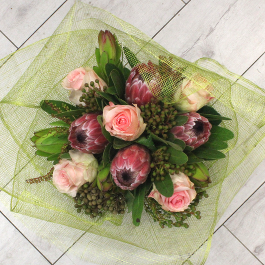PROTEA BEAUTY pink, red, protea, peony, green, leuc, netting, berries Broadfield Flowers Florist Lincoln