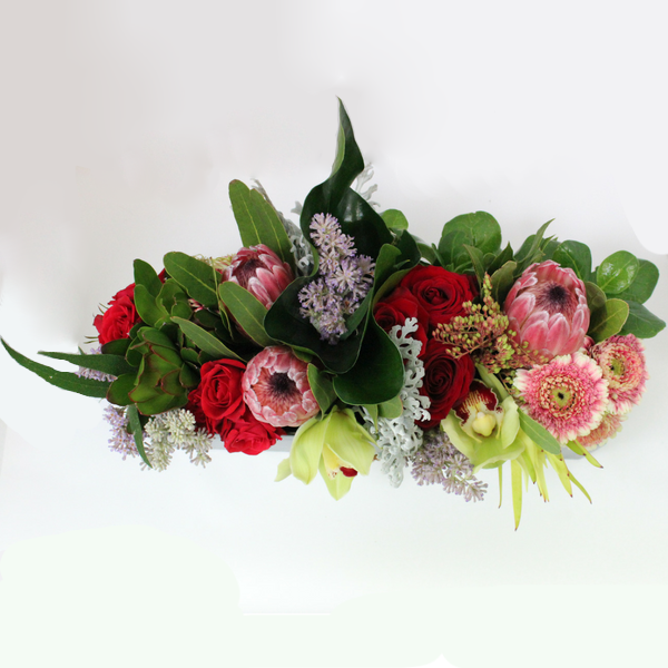 Trough Arrangement flower arrangement, proteas, pink, orchids, gerberas, roses, red, purple, green, white- Broadfield Flowers Florist Lincoln